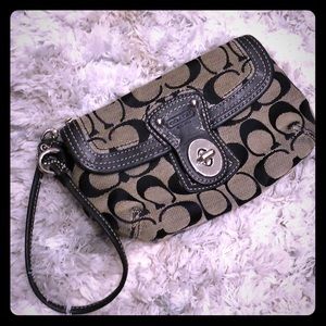 Coach black wristlet purse, leather and cloth.